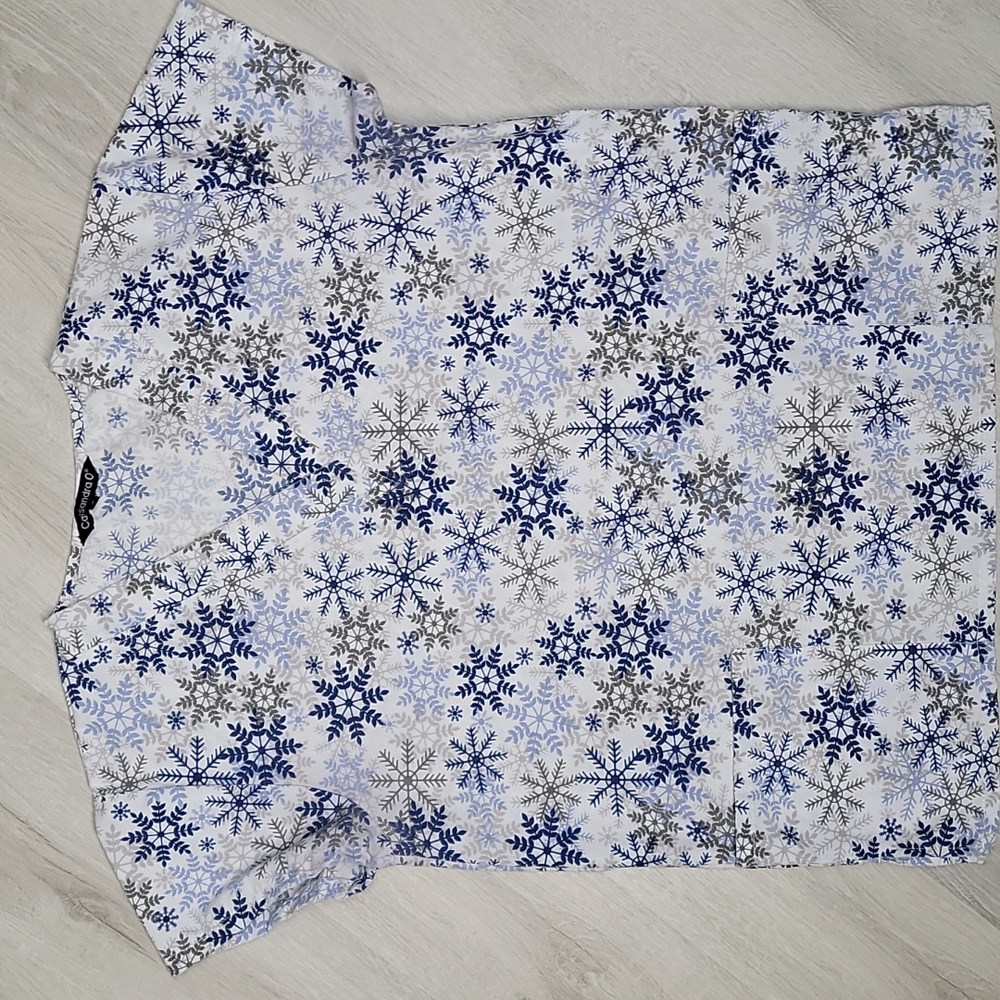 Cassandra O medium V neck scrub top with navy blue and gray snowflakes [24]